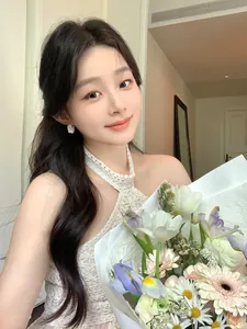 Romantic zircon hollowed flower earrings worn by a model holding fresh flowers