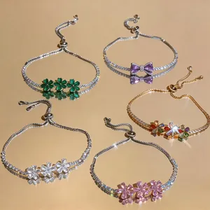 Macro view of adjustable bracelets featuring sparkling flower and bow-shaped zircon stones