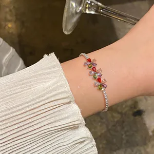 Elegant multi-color flower zircon bracelet with 18k gold plating shown on a wrist