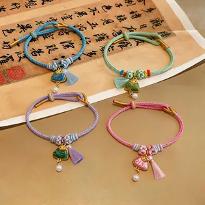 Handmade braided bracelets with triangle charms and tassels in New Chinese style