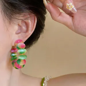 Close-up of macaron gradient beaded hoop earrings showing the vibrant dopamine colors