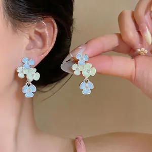 Elegant dopamine style floral drop earrings with rhinestones and enamel petals