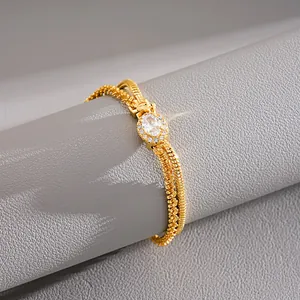 Detailed macro view of 18k gold-plated double-layer bracelet with an oval zircon