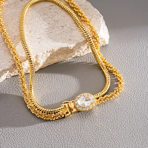Close-up view of 18k gold plated double layer bracelet featuring a sparkling oval zircon centerpiece