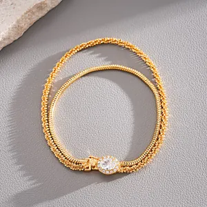 Detailed view of 18k gold plated double-layer bracelet with oval zircon centerpiece