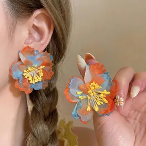 Exquisite orange and blue chiffon flower earrings with a vibrant summer vacation vibe.