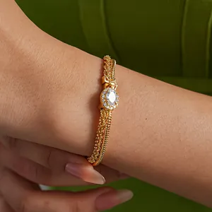 Close-up of elegant double-layered 18k gold plated bracelet with oval cubic zirconia.