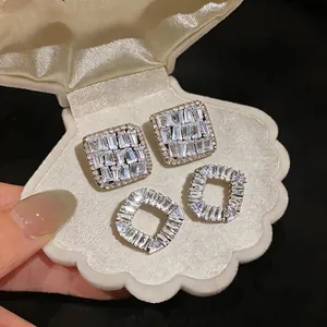 Elegant French style sparkling zircon stud earrings displayed in a shell gift box.