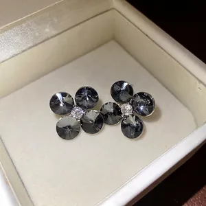 Exquisite silver needle grey zircon flower stud earrings in a luxury white velvet gift box