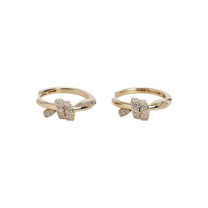 Elegant 14k gold plated knot hoop earrings with sparkling pavé crystals for women