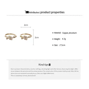 Detail of 14k gold plated knot hoop earrings with zirconium measurements