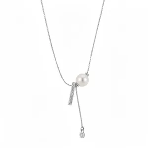 Elegant silver necklace with pearl and textured metal bar pendant with zircon charm.