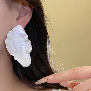 Elegant vintage metal leaf stud earrings with pearlescent white enamel finish for women
