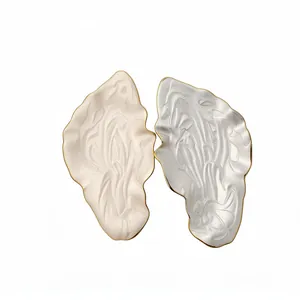 Vintage metal enamel leaf earrings with elegant gold trim and artistic textures