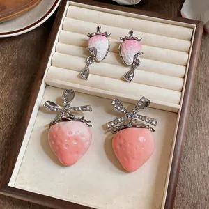 Sweet resin strawberry earrings set with sparkling zircon bows and teardrop dangles