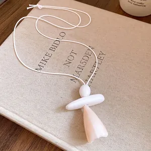 Minimalist resin pendant necklace featuring white leather cord and artistic marble design