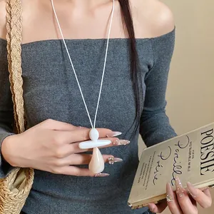Elegant minimalist resin teardrop pendant necklace with white leather cord for women