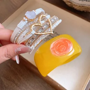 Elegant yellow resin bangle and multi-layered white heart strap bracelet set for women