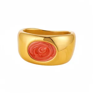 Elegant chunky gold ring featuring a coral rose resin relief inlay on white background