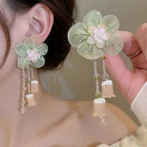 Elegant resort-style flower earrings with glass beads and long tassels for women