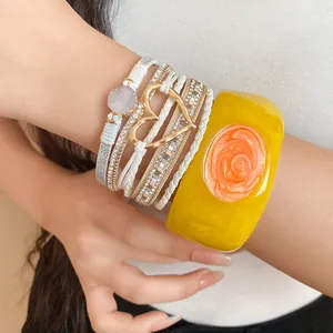 Detailed view of an elegant yellow resin bangle with multi-layered heart bracelet