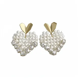Elegant 14k gold-plated heart earrings with white pearls and sparkling crystal studs