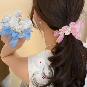 Elegant chiffon flower scrunchie with white pearls for sweet vacation hairstyles