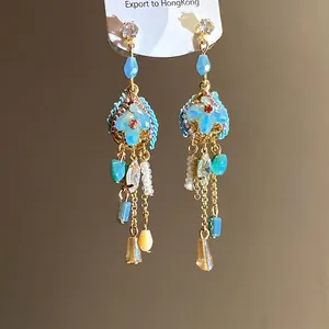 Vintage silver needle earrings with blue stones and long gold tassels for women