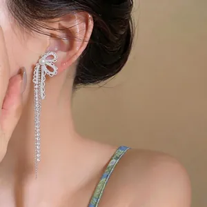 Elegant silver bow drop earrings with sparkling zircons, pearls, and long tassels for women