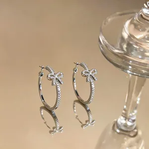 Elegant silver bow hoop earrings with sparkling cubic zirconia for women