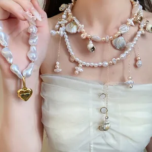 Vintage double-layer necklace with baroque pearls, golden shells, and heart pendant