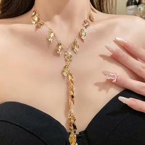 Elegant gold tassel necklace featuring delicate pleated leaf charms for stylish women
