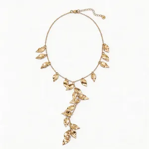 Elegant golden necklace featuring layered wrinkled leaf tassels in a vintage style.