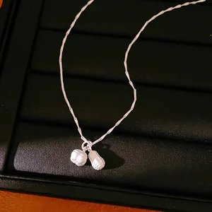 Elegant silver peanut and pod pendant necklace with minimalist bamboo chain for women