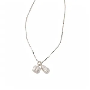 Minimalist silver-toned peanut pendant necklace for stylish and casual daily wear.