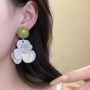 Oversized white flower resin earrings with green top for summer beach vacation style.