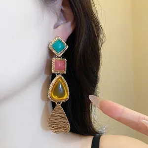 Vintage resin drop earrings with multi-colored geometric shapes and gold-tone finish