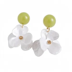 Elegant white flower dangle earrings with olive green beads for beach vacation style