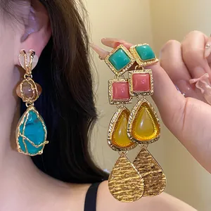Vintage resin drop earrings with gold-tone hardware and colorful tiered pendants. Stunning.