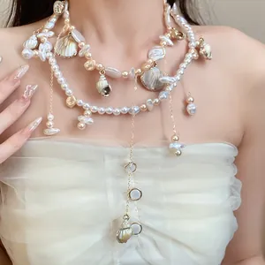 Detailed macro view of an elegant multi-layered pearl necklace with shell charms
