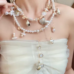 Detailed macro view of layered pearl and shell necklace in retro vacation style.