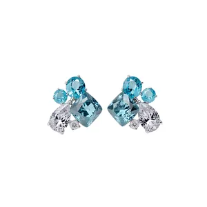 Elegant cluster stud earrings with blue and clear water-drop and cushion-cut zirconia stones.