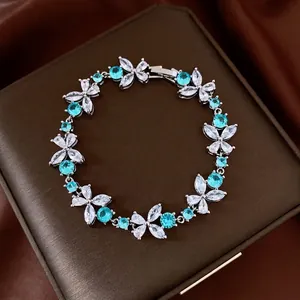 Elegant silver flower bracelet featuring sky blue and white sparkling zircons for women