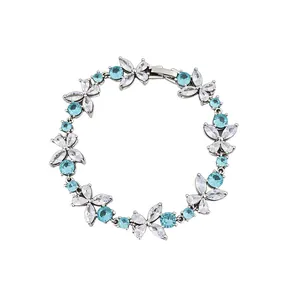 Elegant silver bracelet featuring delicate light blue and clear cubic zirconia flowers