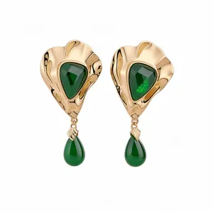 Vintage gold-tone stud earrings featuring triangular green resin and teardrop charms
