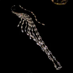 Macro detail of high-end sparkling zircon tassel ear cuff earring in golden finish