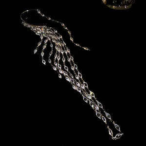 Detailed view of elegant gold-toned zircon tassel ear cuff with marquise-cut stones