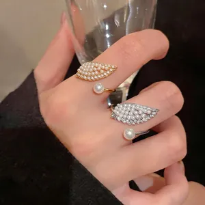 French luxury style zircon pearl wing open ring with elegant adjustable design for women.
