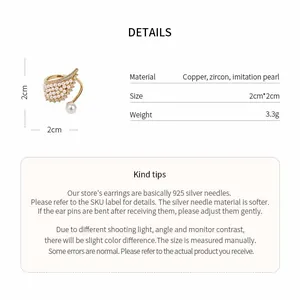Detailed view of gold-tone wing ring with zircon and pearls plus product dimensions