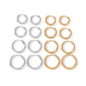Set of minimalist titanium steel hoop earrings in gold and silver, showing various sizes